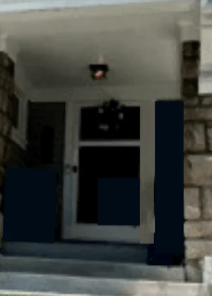 The same front porch before: bare trim, unfinished ceiling, dark unpainted panels